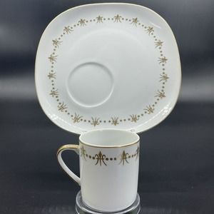 Elegant White and Gold Cup and Saucer Set